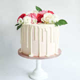 Pink fresh flower drip birthday celebration cake Isle of Man