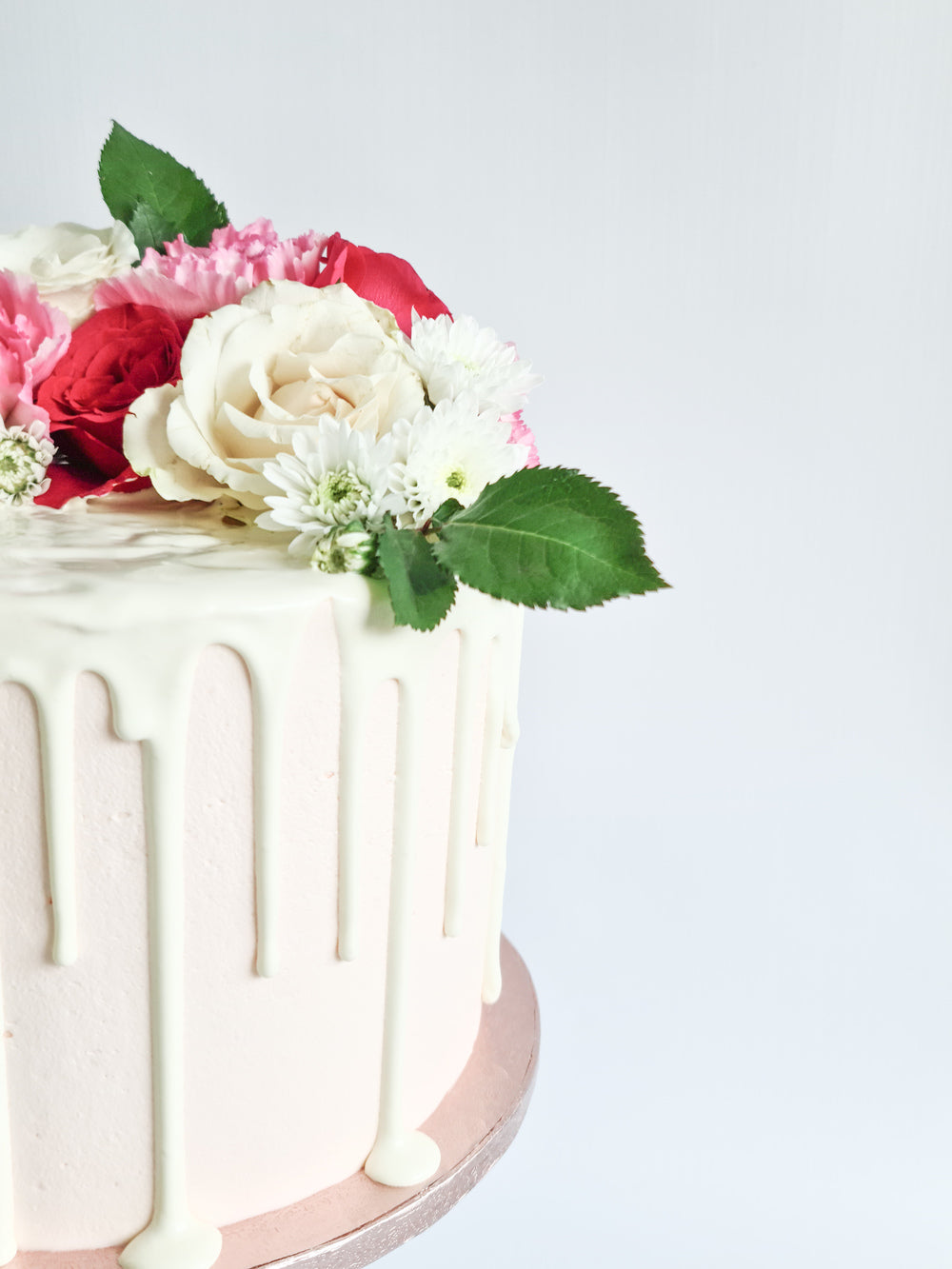 Pink fresh flower drip birthday celebration cake Isle of Man