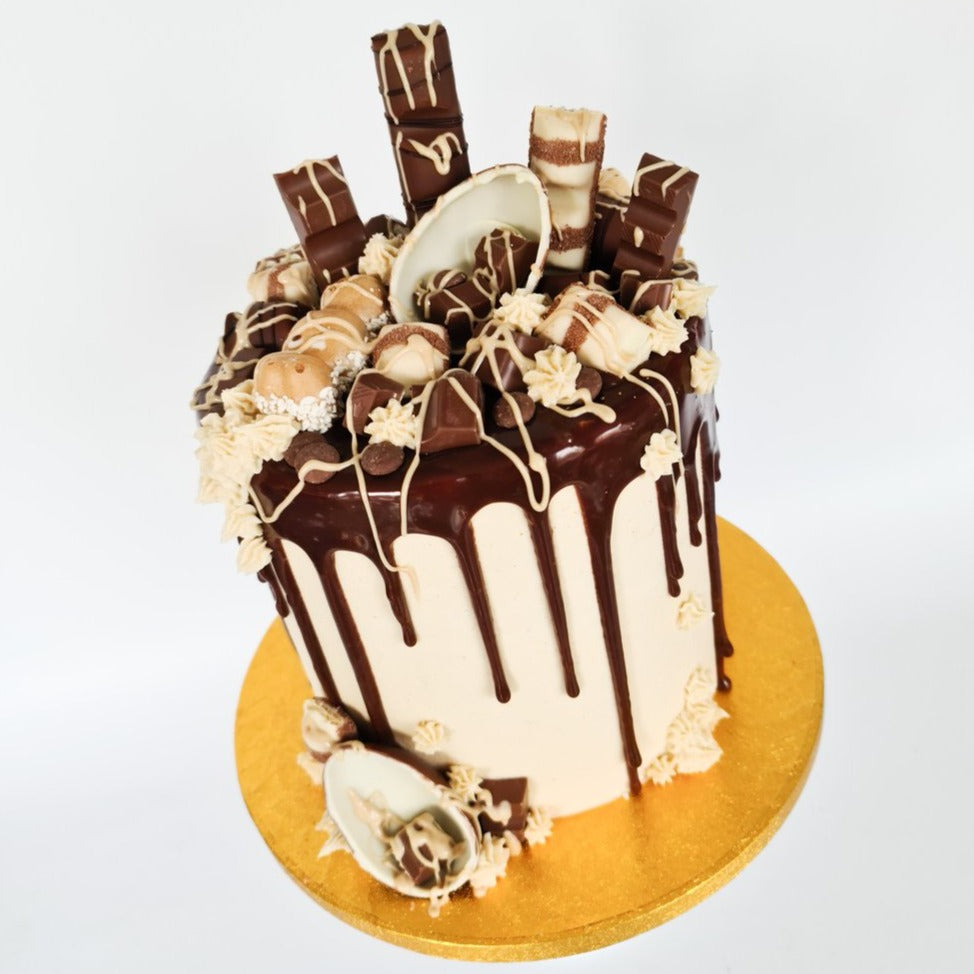 Kinder cake with milk chocolate drip and Bueno sauce for birthday celebration Isle of Man