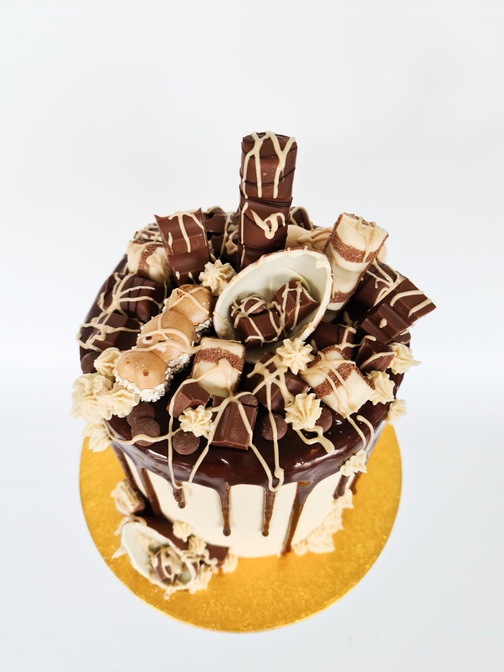 Kinder cake with milk chocolate drip and Bueno sauce for birthday celebration Isle of Man