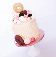 Gorgeous pink doughnut drip birthday or celebration cake on the Isle of Man