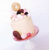 Gorgeous pink doughnut drip birthday or celebration cake on the Isle of Man