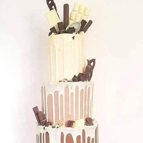 Chocolate fully loaded drip cake for birthday celebration Isle of Man