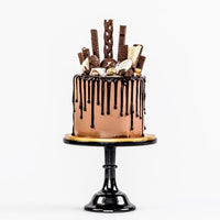 Chocolate fully loaded drip cake for birthday celebration Isle of Man